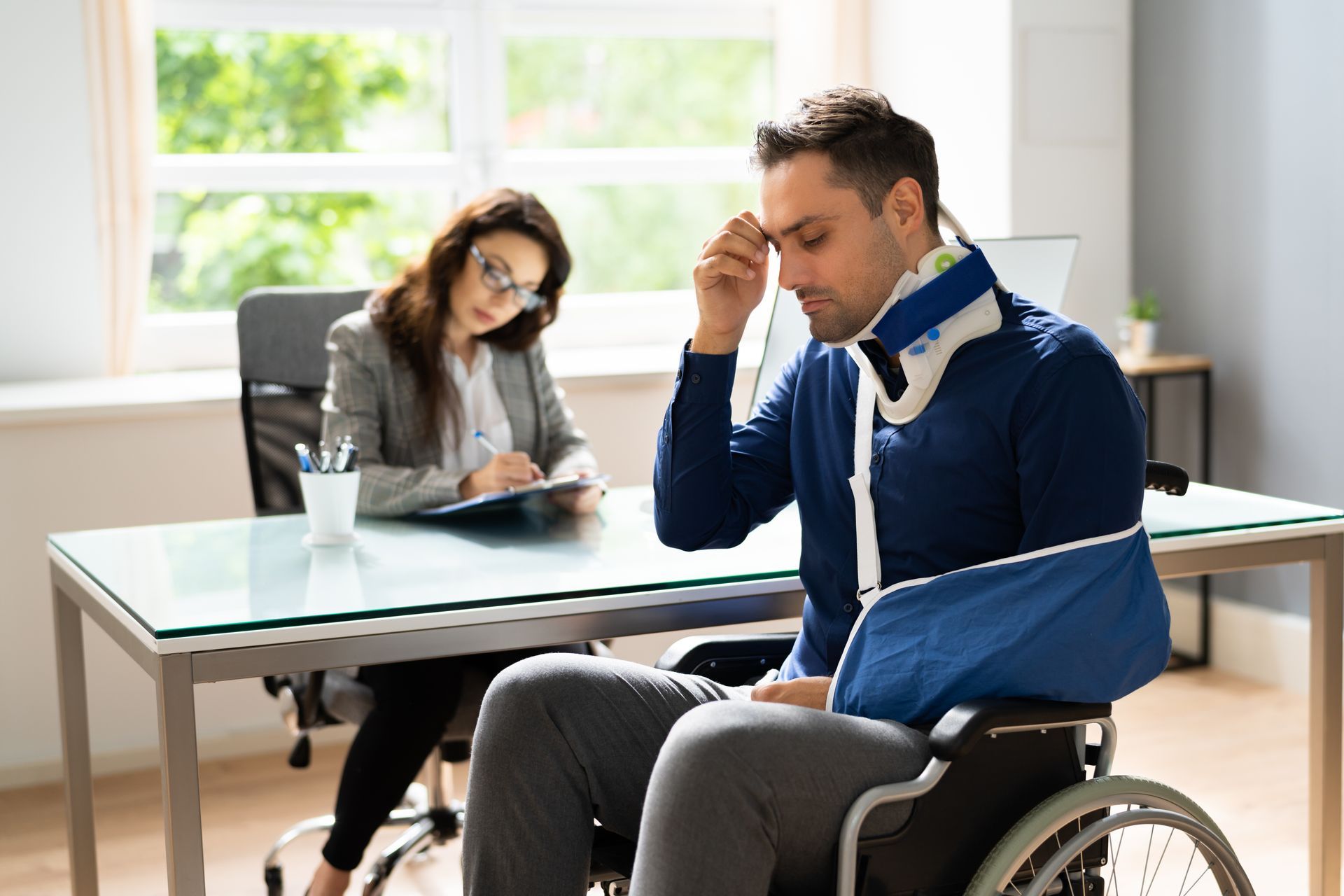 Client discussing documents with a personal injury lawyer